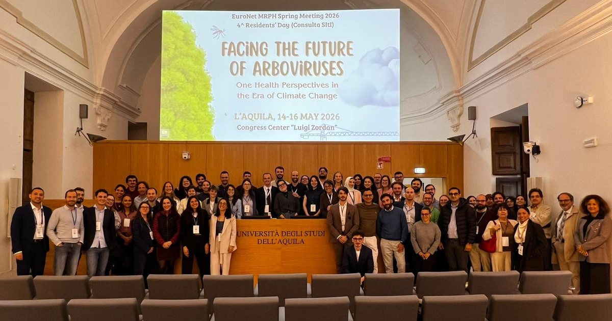 EuroNet MRPH residents at the 2026 Spring Meeting in L'Aquila, in front of the meeting banner.